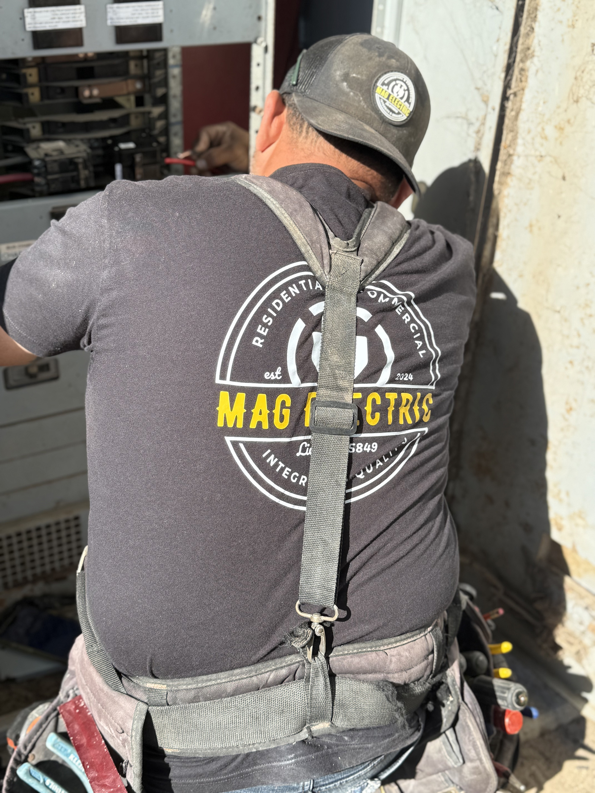 Electrician working on electrical panel service upgrade SLO County CA 93401